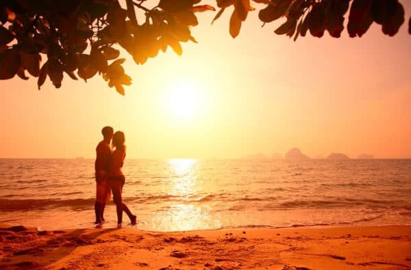 Couple on the beach at sunset