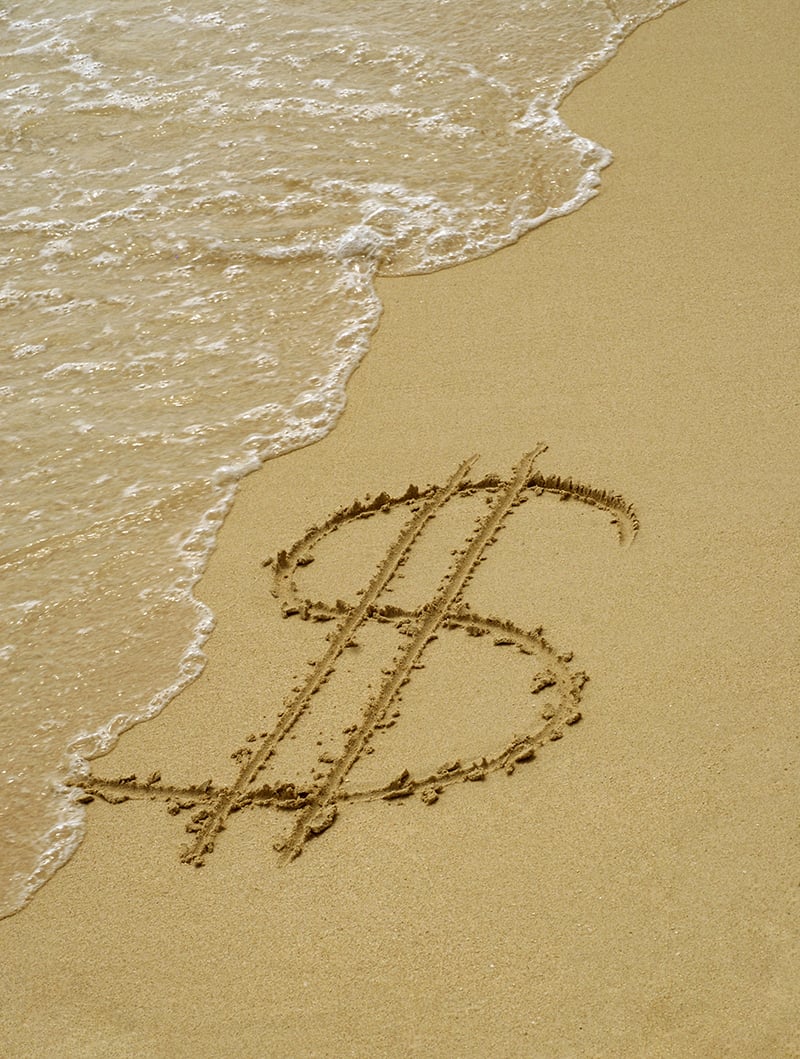 Dollar symbol in the sand