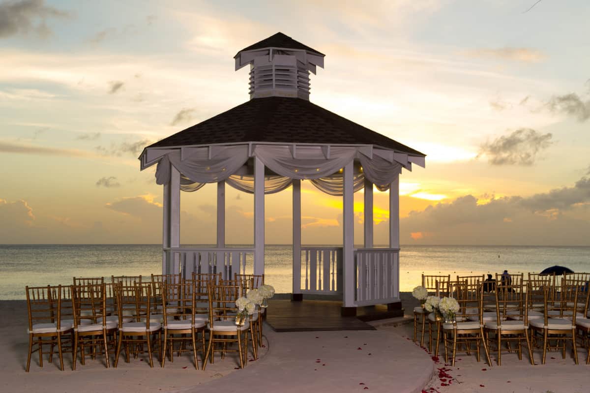 Wedding set up in gazebo with a sunset